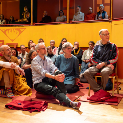 Photo of ordinands in the theatre of the Cambridge Buddhist Centre
